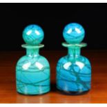 A Pair of Mdina Turquoise, Blue & Green Swirled Glass Decanters with globular stoppers,