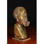 A Fine Carved Brown Granite Head of an African Man Smoking a Pipe, signed Vesta,