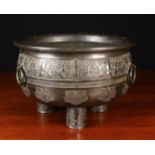 A Large 18th Century Chinese Bronze Bowl having a decoratively cast frieze fitted with three ring