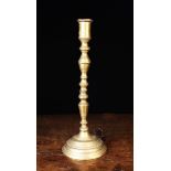 A Tall 18th Century Bronze Candlestick cast in three sections.