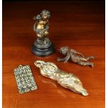 A 19th Century Weighted Copper Alloy Figure of a Cherub holding aloft a suspension loop,