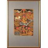 An Antique Tibetan Thangka painted in gouache on fabric with deities and figures riding on the
