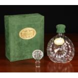 A Remy Martin Baccarat Crystal Decanter & Stopper housed in a green faux suede clad box with