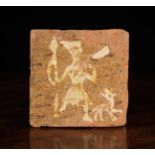 A Rare Medieval Terracotta Tile slip glazed with a hunter with horn and dog, approx.