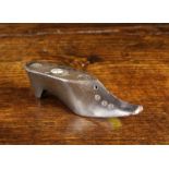 A 19th Century Slate 'Show to Bed' Taper Holder carved in the form of a shoe with turned roundel