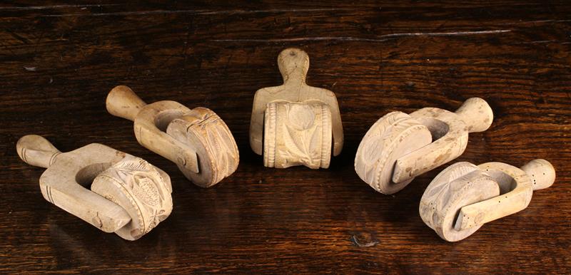 Five Antique Butter / Pastry Rollers carved with decorative moulds; floral sprigs,