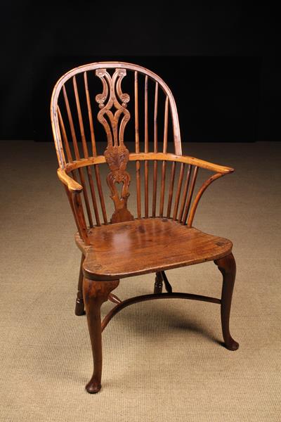 A Rare High Backed Yew-wood Windsor Armchair of generous proportions.