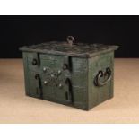 A 17th Century Wrought Iron Strong Box clad in interwoven studded straps and fitted with a lock and