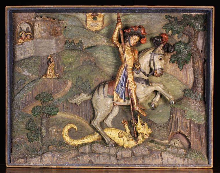 A Fabulous 16th Century Polychromed Relief Carving of Saint George on horseback dressed in gilded