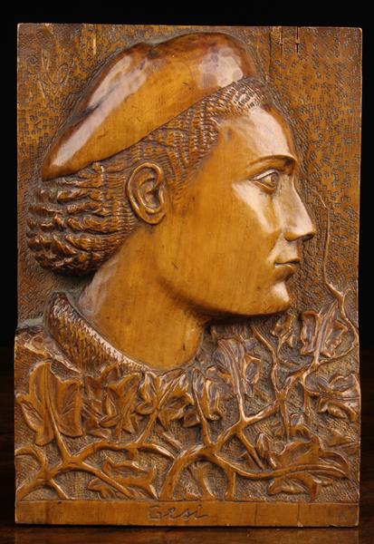 A Relief-Carved Fruitwood Panel depicting a profile head portrait inscribed to the base 'Gesi'.