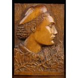 A Relief-Carved Fruitwood Panel depicting a profile head portrait inscribed to the base 'Gesi'.