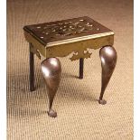 A Small 19th Century Brass Footman with a pierced rectangular top plate and cabriole front legs