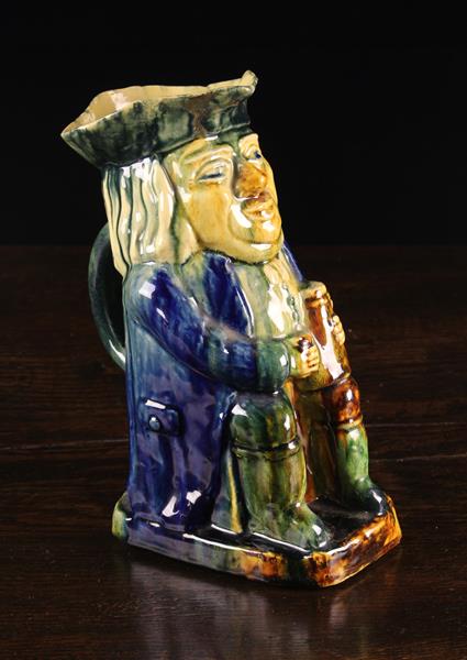 A Large 19th Century Toby Jug dripped in blue, green and brown glaze, 11" (28 cm) in height.