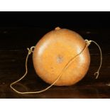 A Gourd Pilgrim Flask of round cushion form engraved with intricate decoration and having a small