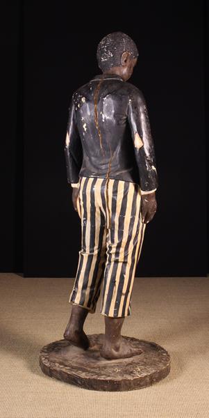 A Near Life Sized Late 19th Century Carved & Polychromed Advertising Figure of a bare-foot boy - Image 3 of 3