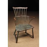 An 18th Century Painted Comb-back Windsor Armchair.