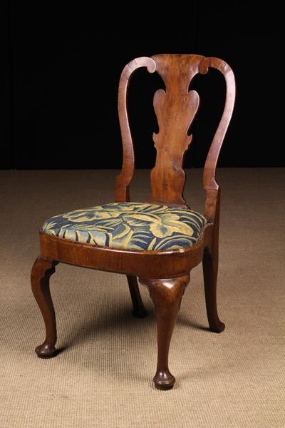 A Queen Anne Walnut Side Chair.