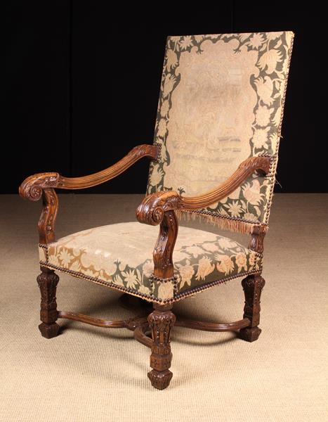 A Large Late 19th Century French Carved Walnut Fauteuil in the Louis XIV Style.