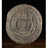 A Large 17th Century Wooden Honey Cake Mould carved with the armorial crest of Charles IIencircled