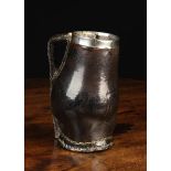A Late 18th/Early 19th Century Leather Tankard of baluster form with a cut out triangular handle,