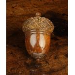 An Early 19th Century Carved Cocquilla Nut Container carved in the form of an acorn with screw