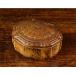 An 18th Century Carved Burr Walnut Snuff Box. The scalloped top enriched with carving, 1½" (3.