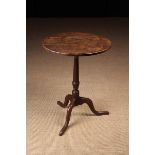 A George III Oak Tripod Table.
