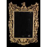 A Charles II Carved Giltwood Wall Mirror.