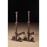 A Pair of Tall 18th Century Wrought Iron Fire Dogs.