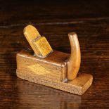 A 19th/Early 20th Century Treen Snuff Box in the form of a carpenter's plane, 3¾" (9.