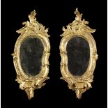 A Pair of 18th Century Carved Giltwood Girandoles.