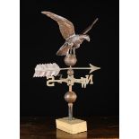 A Vintage Weather Vane surmounted by a three dimensional embossed sheet copper eagle perched upon