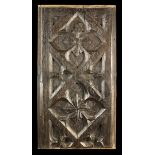 A 16th Century Carved Oak Panel, Circa 1520, formed from two cut down and re-joined sections,