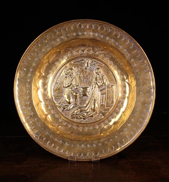 A 16th Century Repoussé Brass Alms Dish.