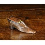 A 19th Century Treen Snuff Box in the form of a lady's shoe embellished with brass piqué work,