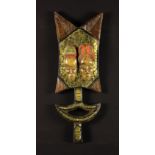 A Carved African Decorative Shaped and Pierced Wooden Slab emblazoned with a pair of relief carved