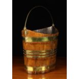 An Early 19th Century Navette Form Peat Bucket with brass bound mahogany staves and a brass swing