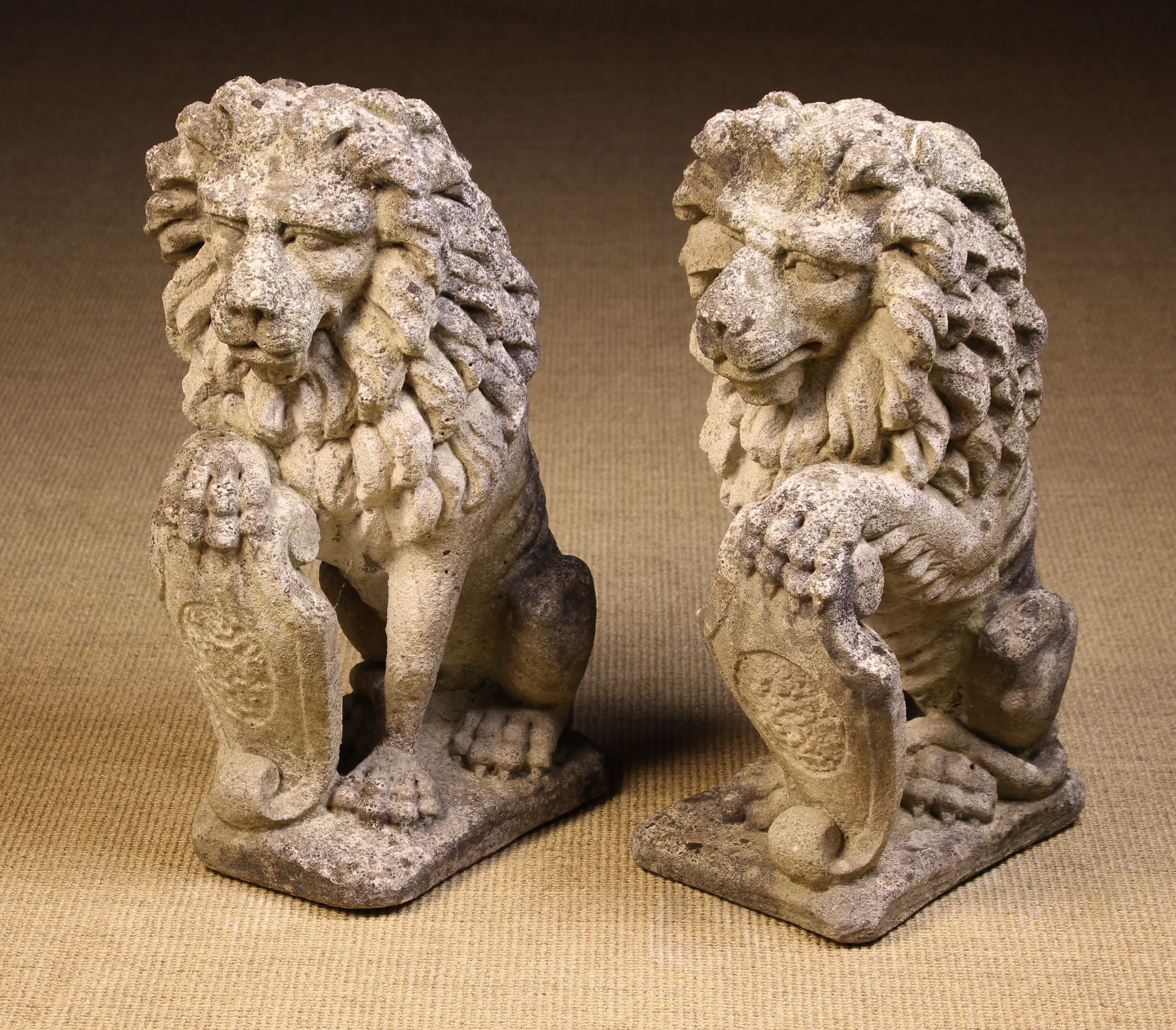 A Pair of Composite Stone Architectural Lions Sejant.