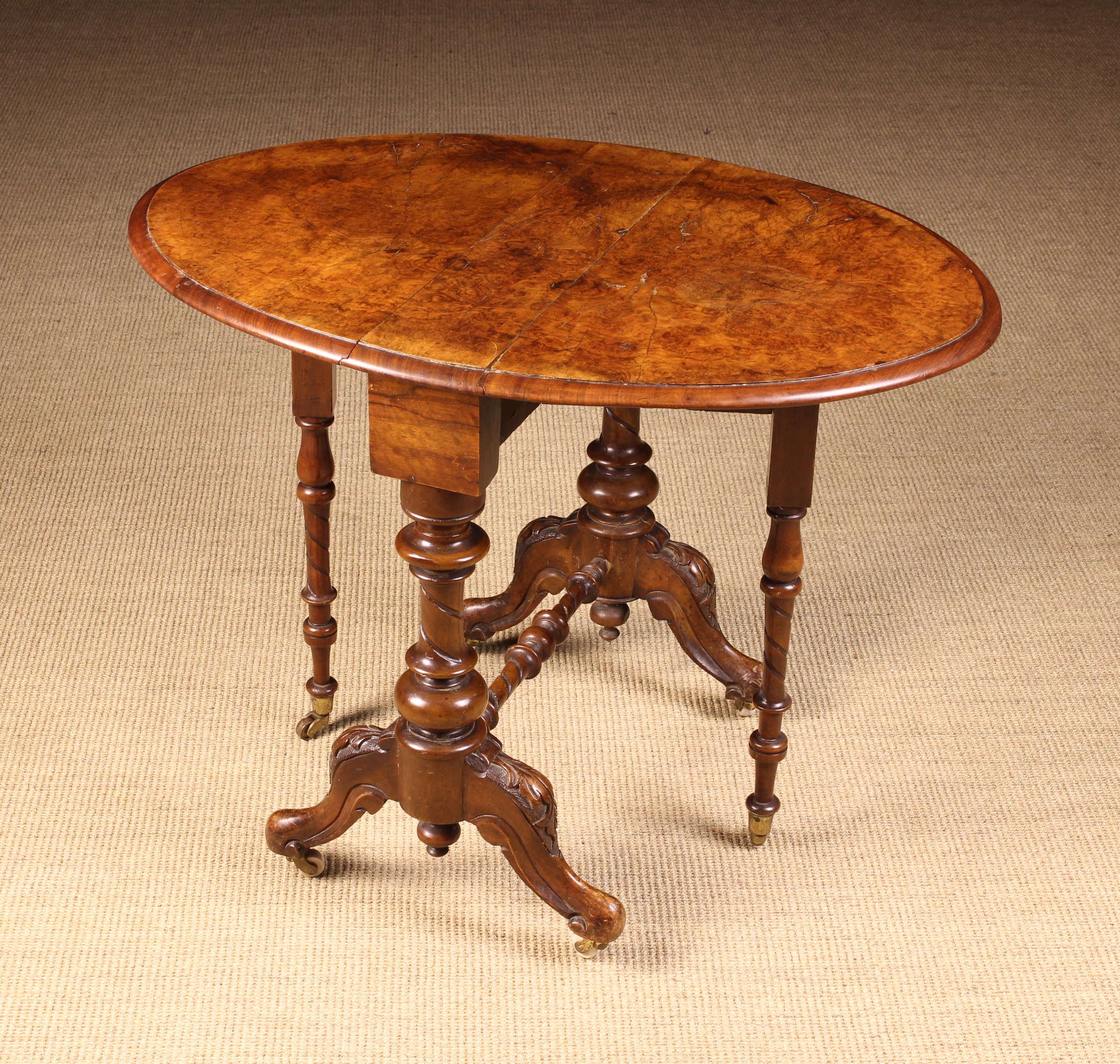 A Small Victorian Figured-Walnut Sutherland Table.