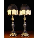 A Pair of Ornamental Cast Brass and 'Petit Granit' Marble Side Lamps with ornately cast stems