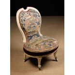 A Victoiran Balloon Back Chair painted white with needlework upholstery.