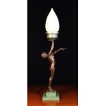An Art Deco Figural Lamp on the form of a female nude holding aloft a lamp with Vaseline glass