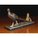 A Cold Painted Spelter Pheasant Match Striker mounted on a black marble base, 8¼" (21 cm) high,