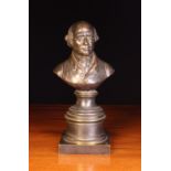 A Small 19th Century Bronze Bust of a Gentleman on a turned pedestal inscribed on back;