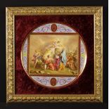 A Vienna Porcelain Plaque mounted in a carved giltwood frame.