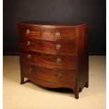 A George IV Mahogany Bow-front Chest of Drawers.