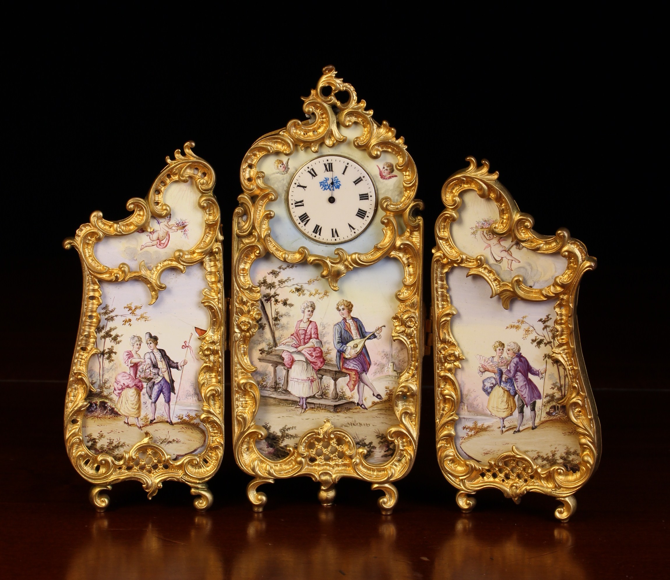 A Viennese Enamel Miniature Folding Triptych Dressing Screen in an elaborately cast gilt bronze