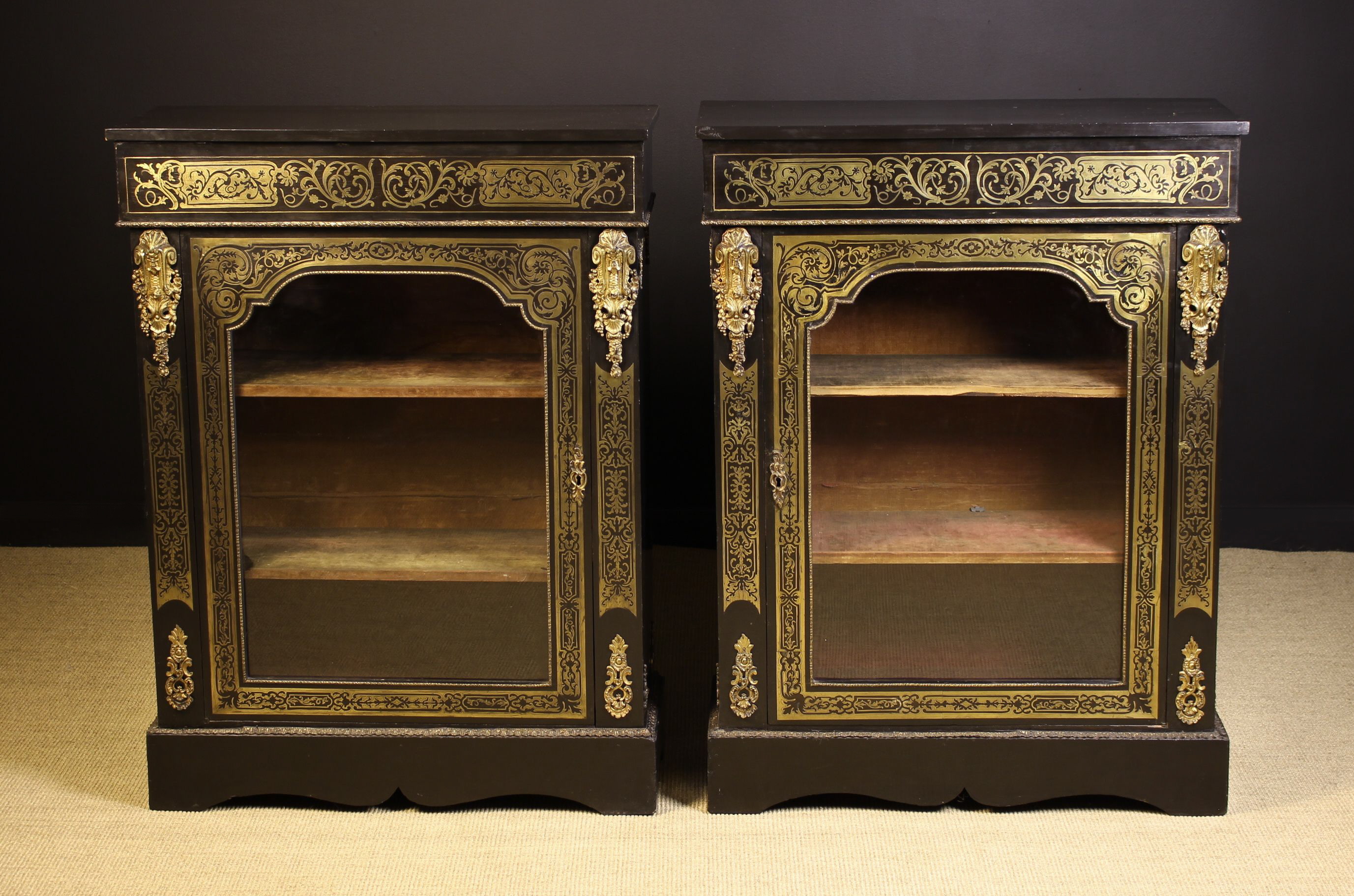 A Pair of 19th Century Ebonised Boullework Pier/Side Cabinets.