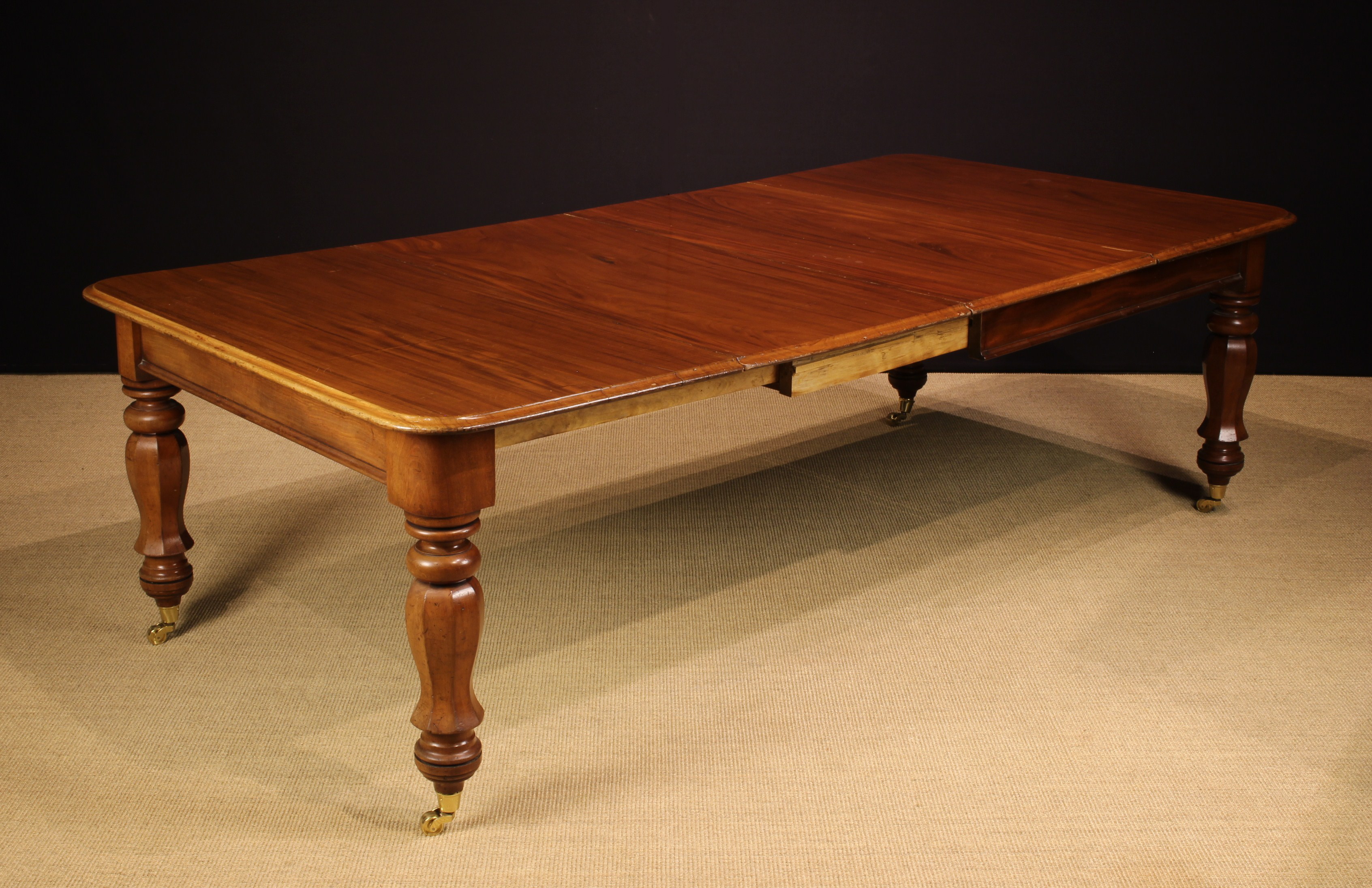 An Early Victorian Mahogany Extending Dining Table of handsome proportions.