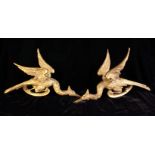 A Pair of 18th Century Carved Giltwood Chippendale Ho-ho Birds perched on C-scrolls 12½" (31 cm) in
